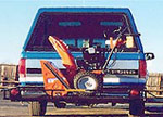 Tilt-a-Rack hitch mounted trailer system utility uses for equipment and product transportation.